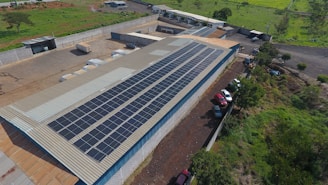 Solar panels cover a factory roof.