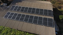 Solar panels are installed on a rooftop.