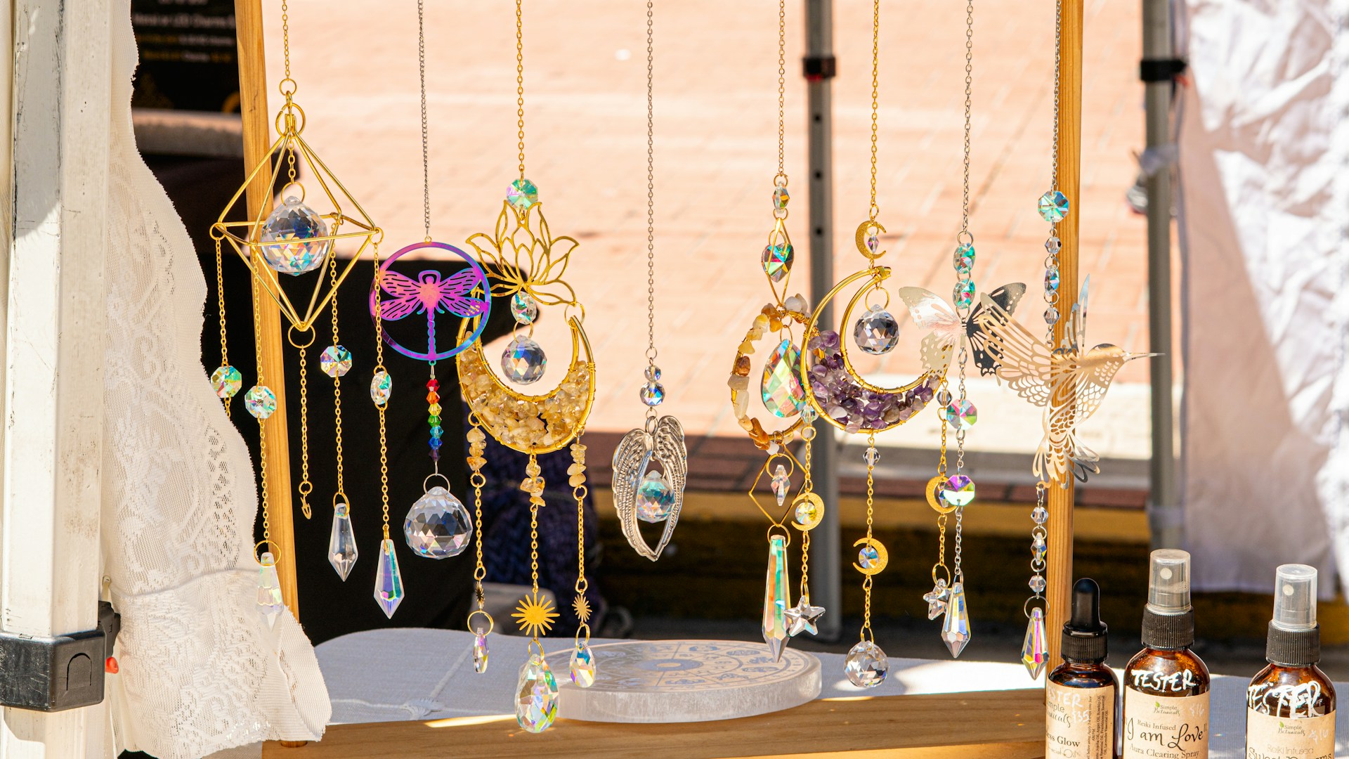 Jewelry and crystals are displayed for sale.