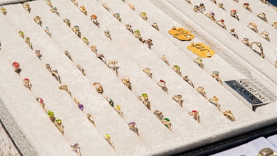 Many rings are displayed in a jewelry tray.