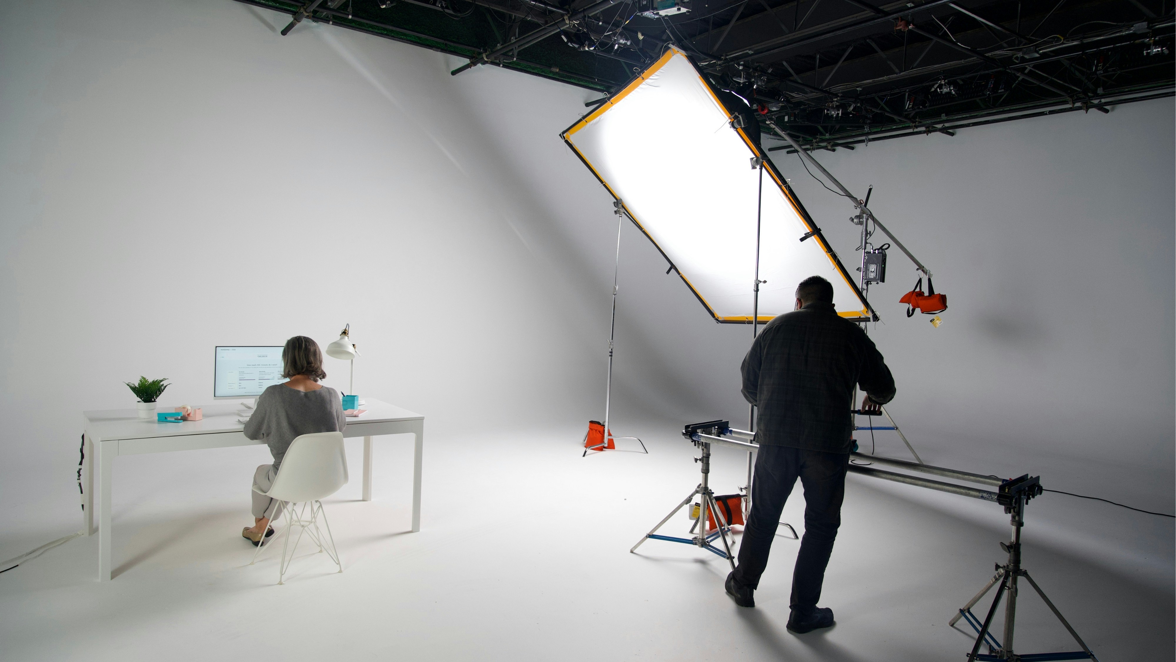 Filming a scene in a professional studio setting.