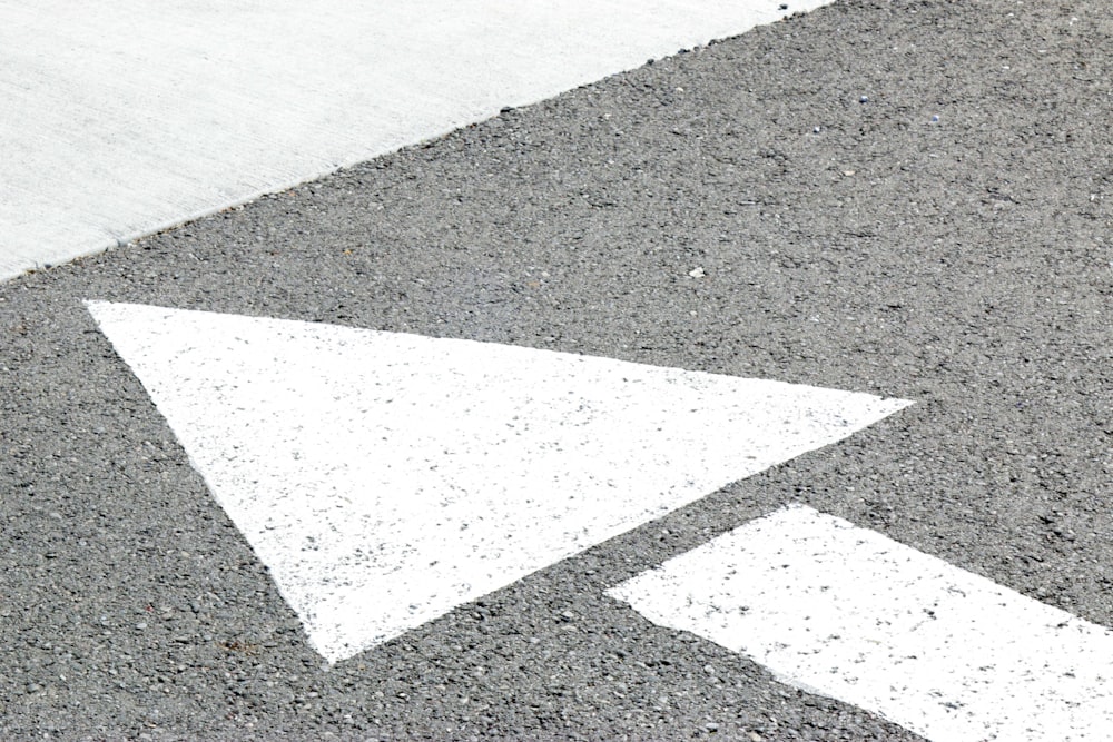 Fresh directional arrow painted on a sealcoated commercial parking lot