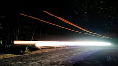 Long exposure photo of moving headlights at night.