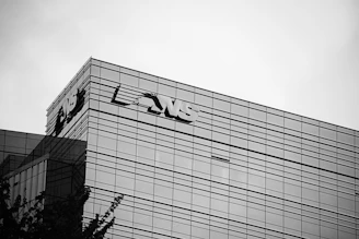 The image shows a modern office building.