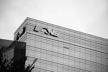 The image shows a modern office building.