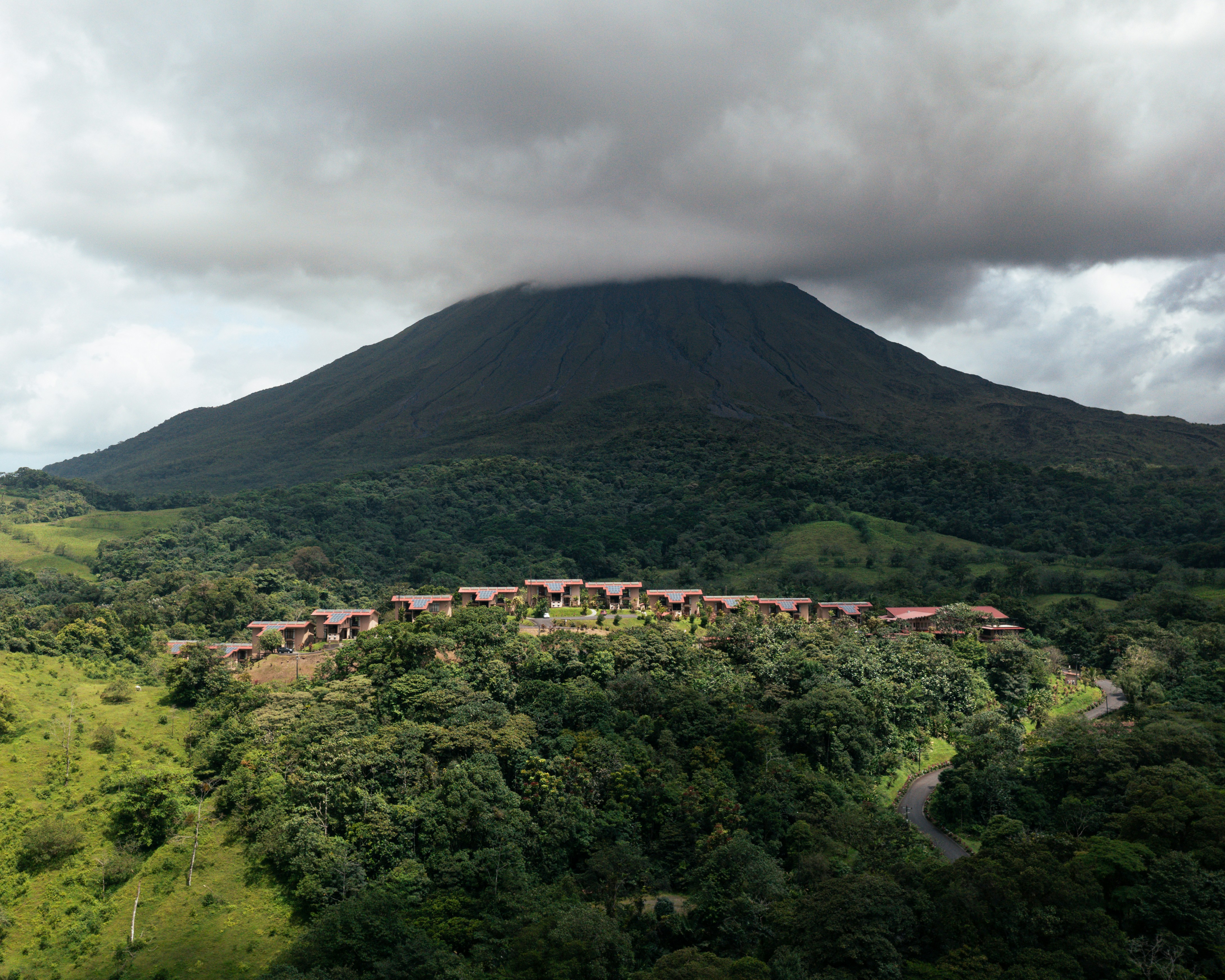 Mountain and forest landscape with a resort at the bottom.