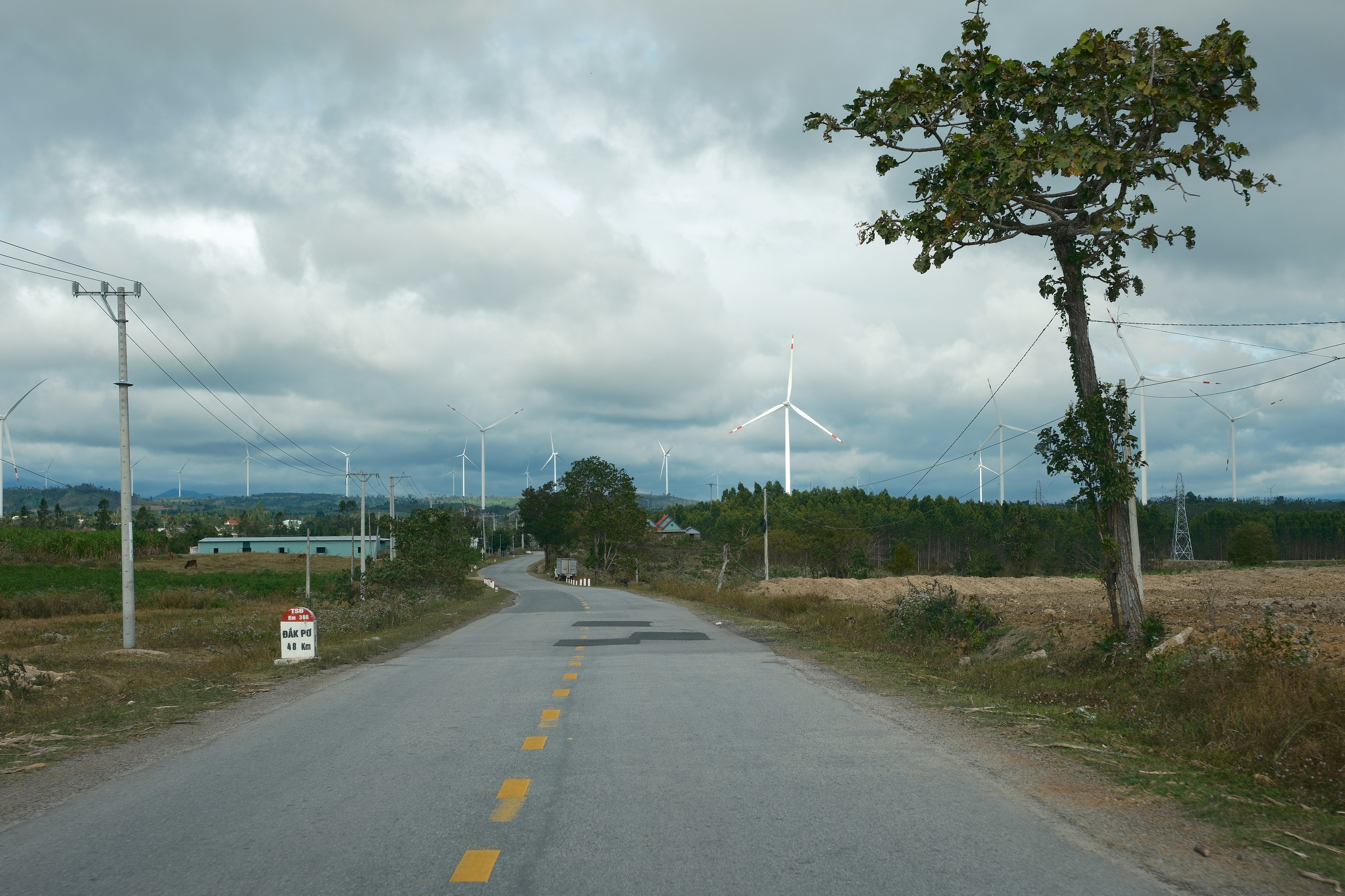 Family driving an electric SUV on a highway during a road trip