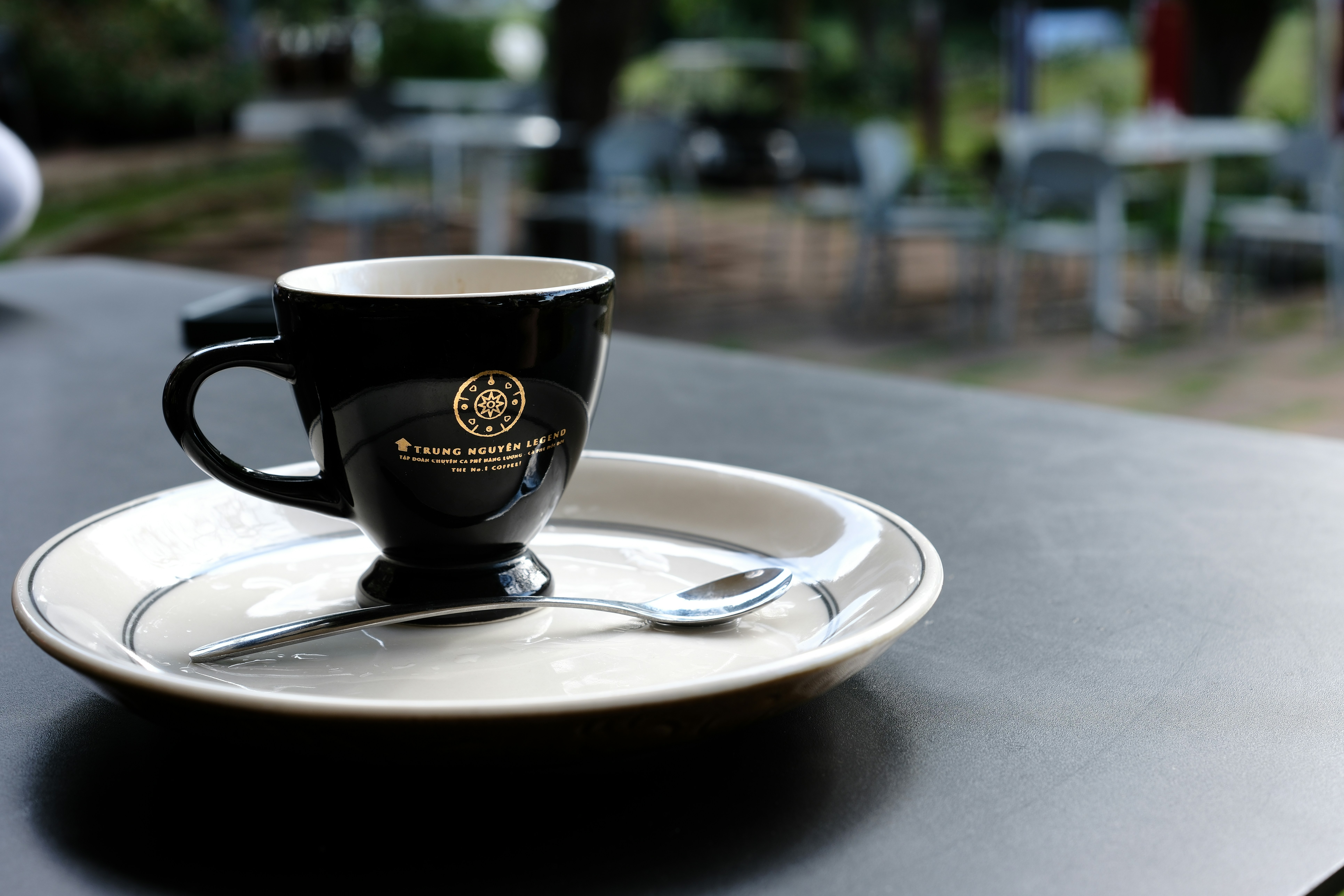Coffee cup sits on a saucer.