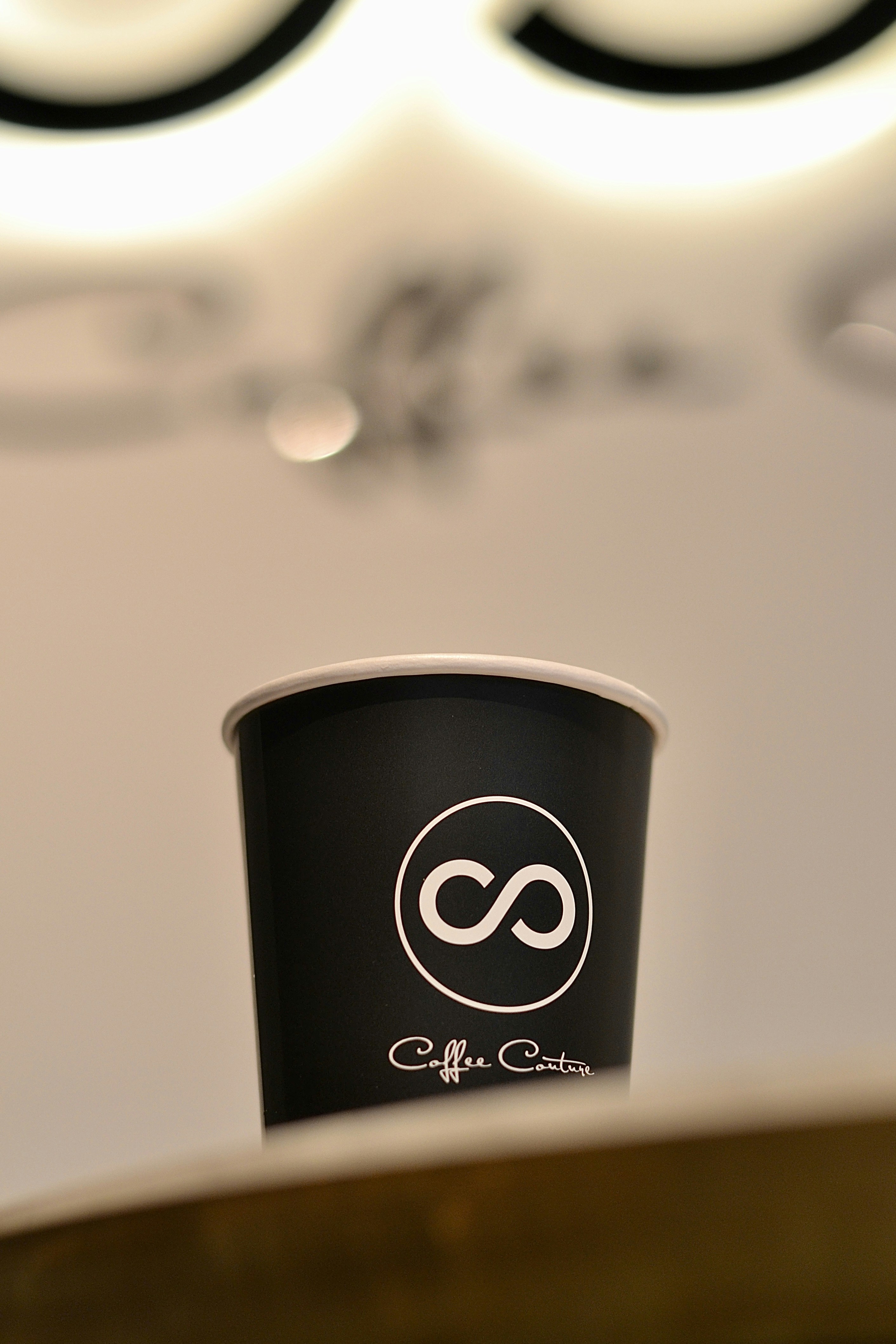 A coffee cup with a unique logo.