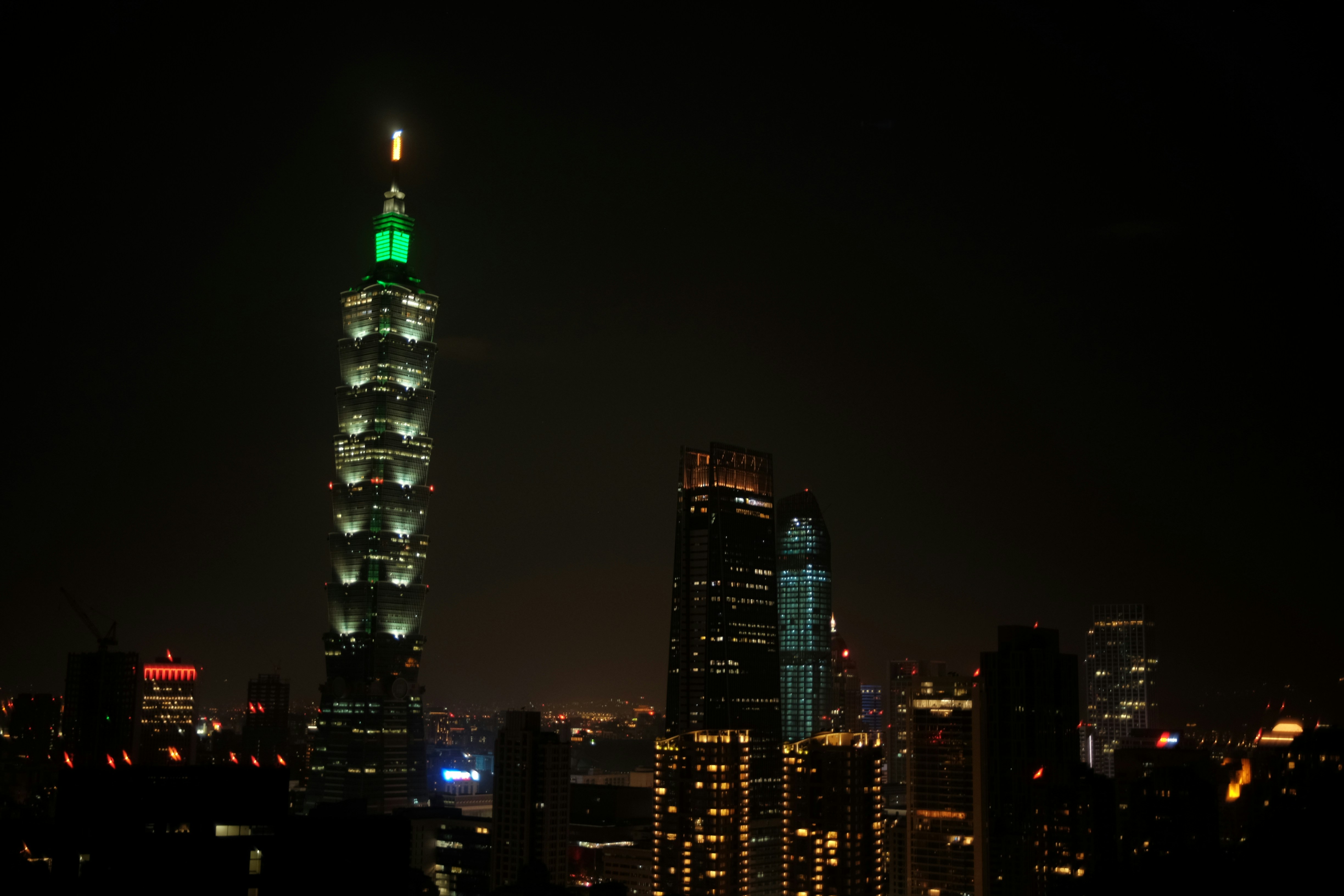 Taipei 101 illuminated at night.