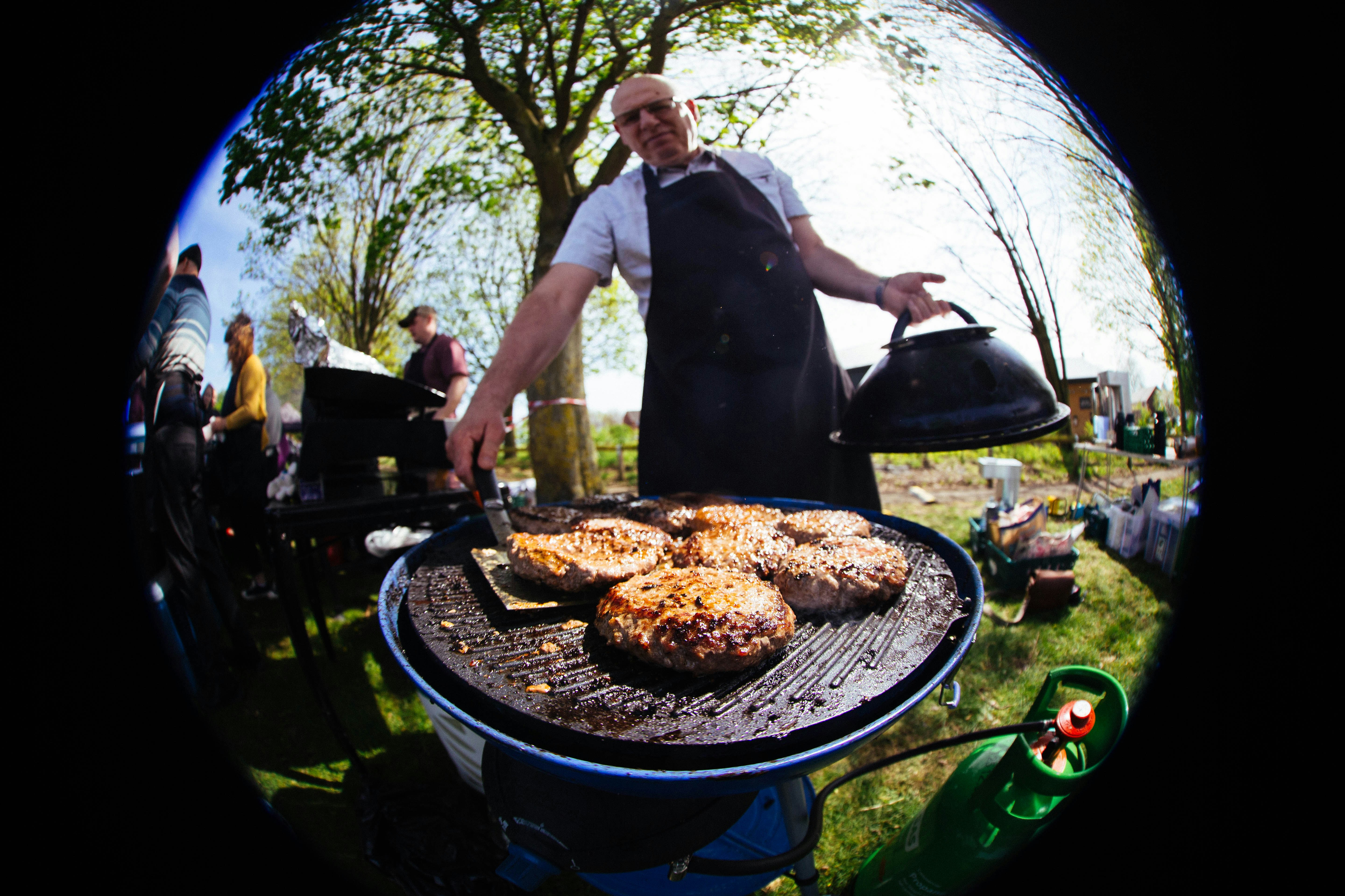 chef grilling at outdoor event - bbq outside catering near me