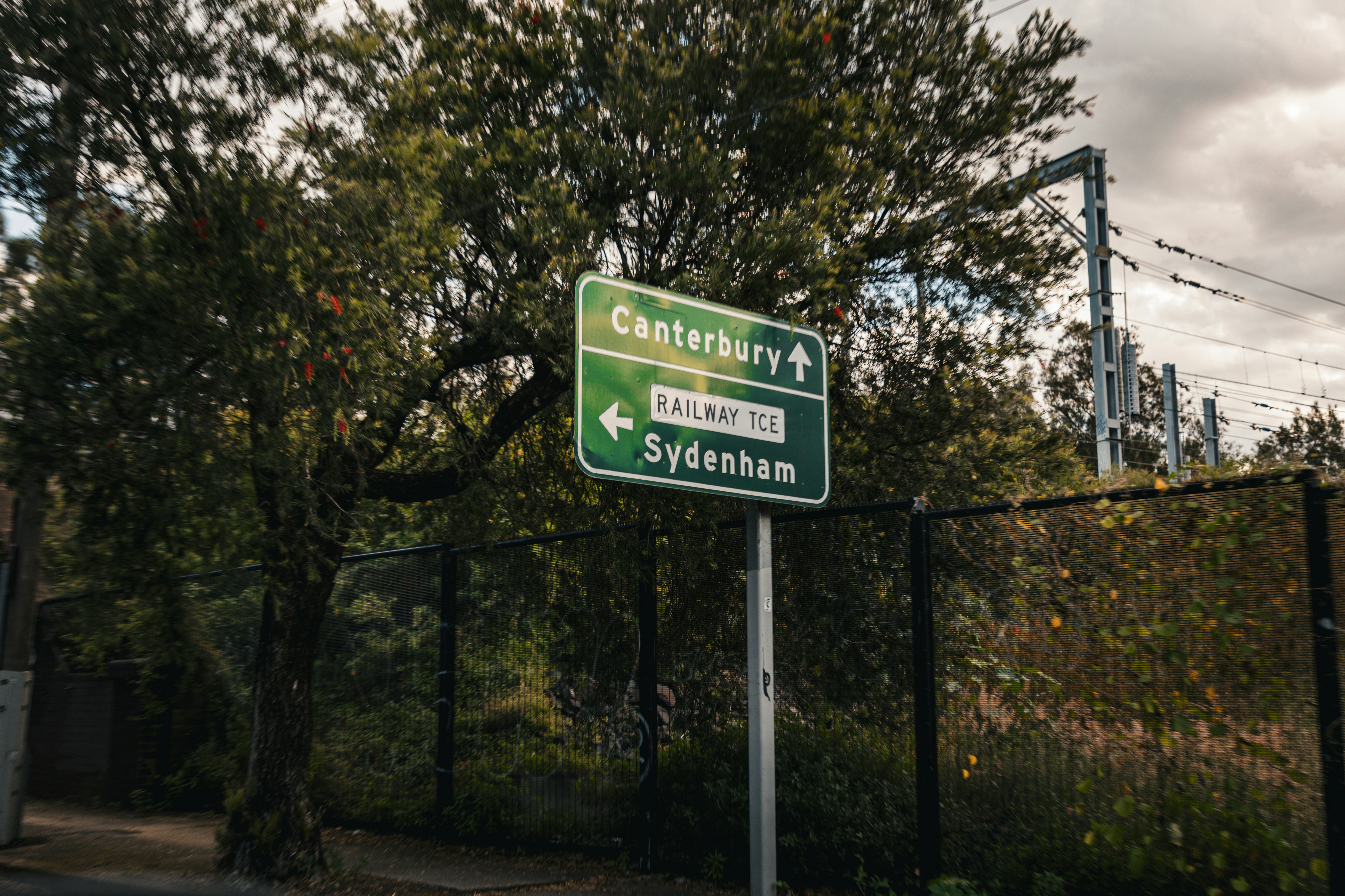 A sign indicates directions to canterbury and sydenham