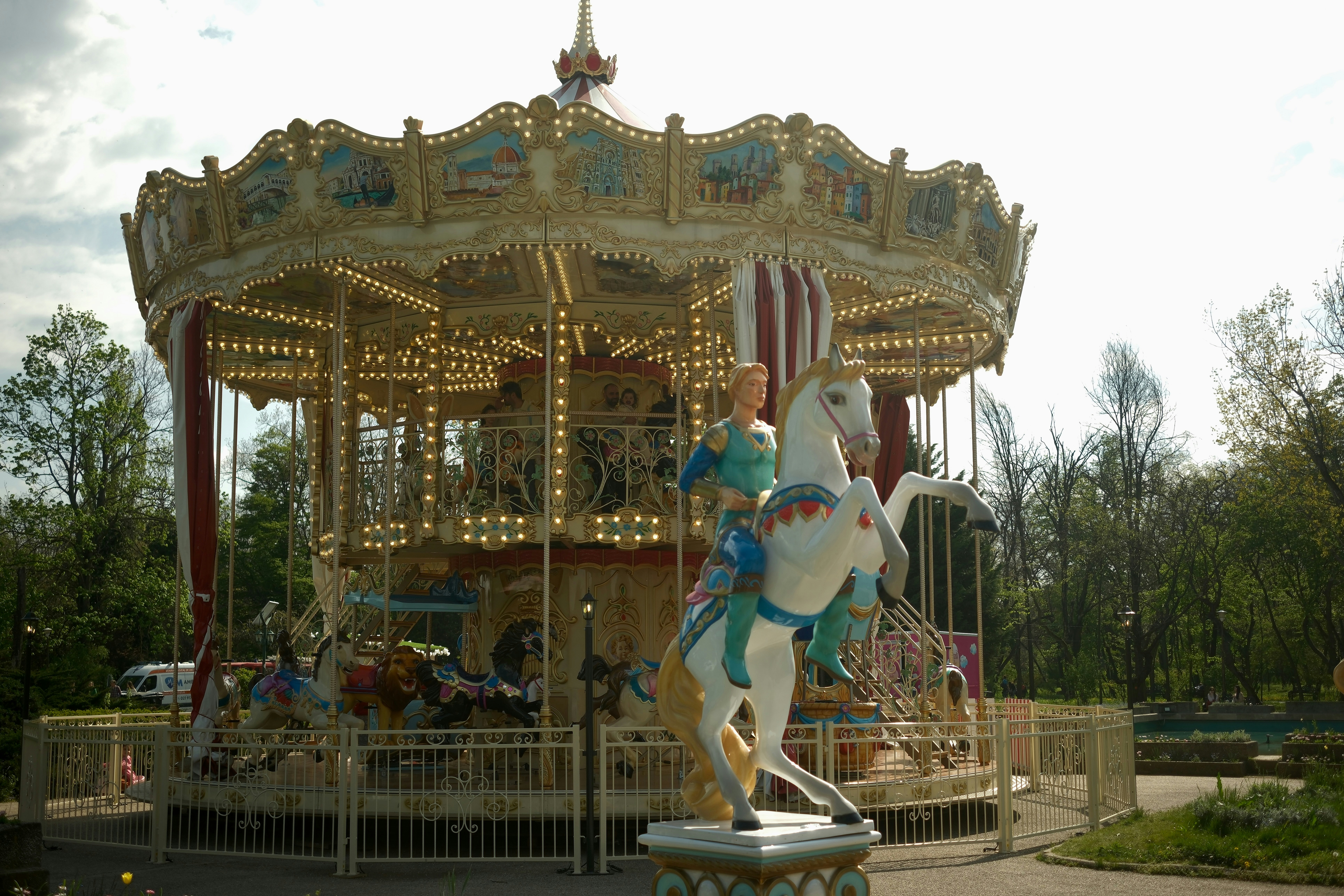 A beautiful carousel is in the park.