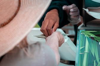 Someone is paying for something with cash.