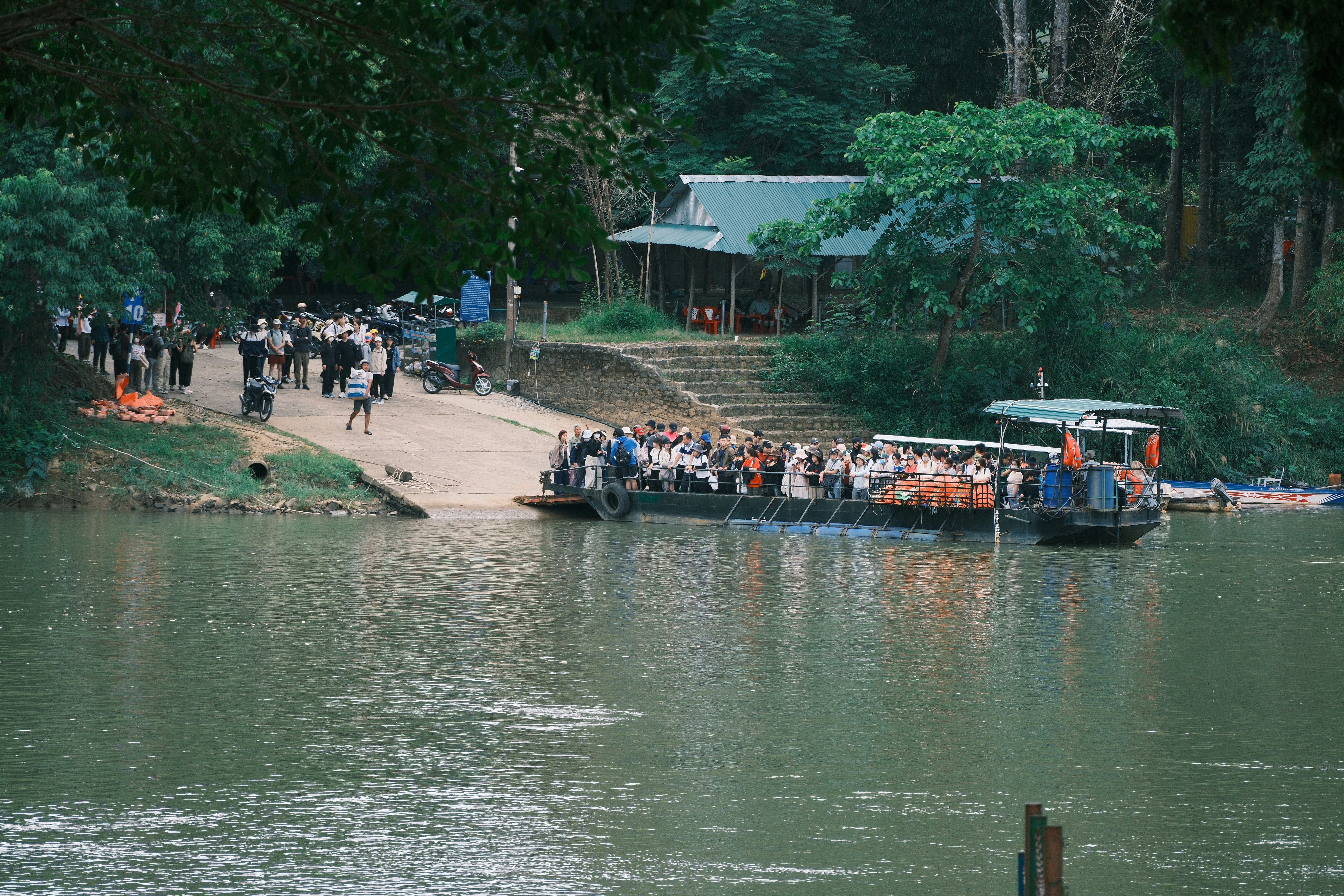 A ferry transports people across a river.
