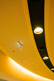 A modern ceiling with recessed lighting.