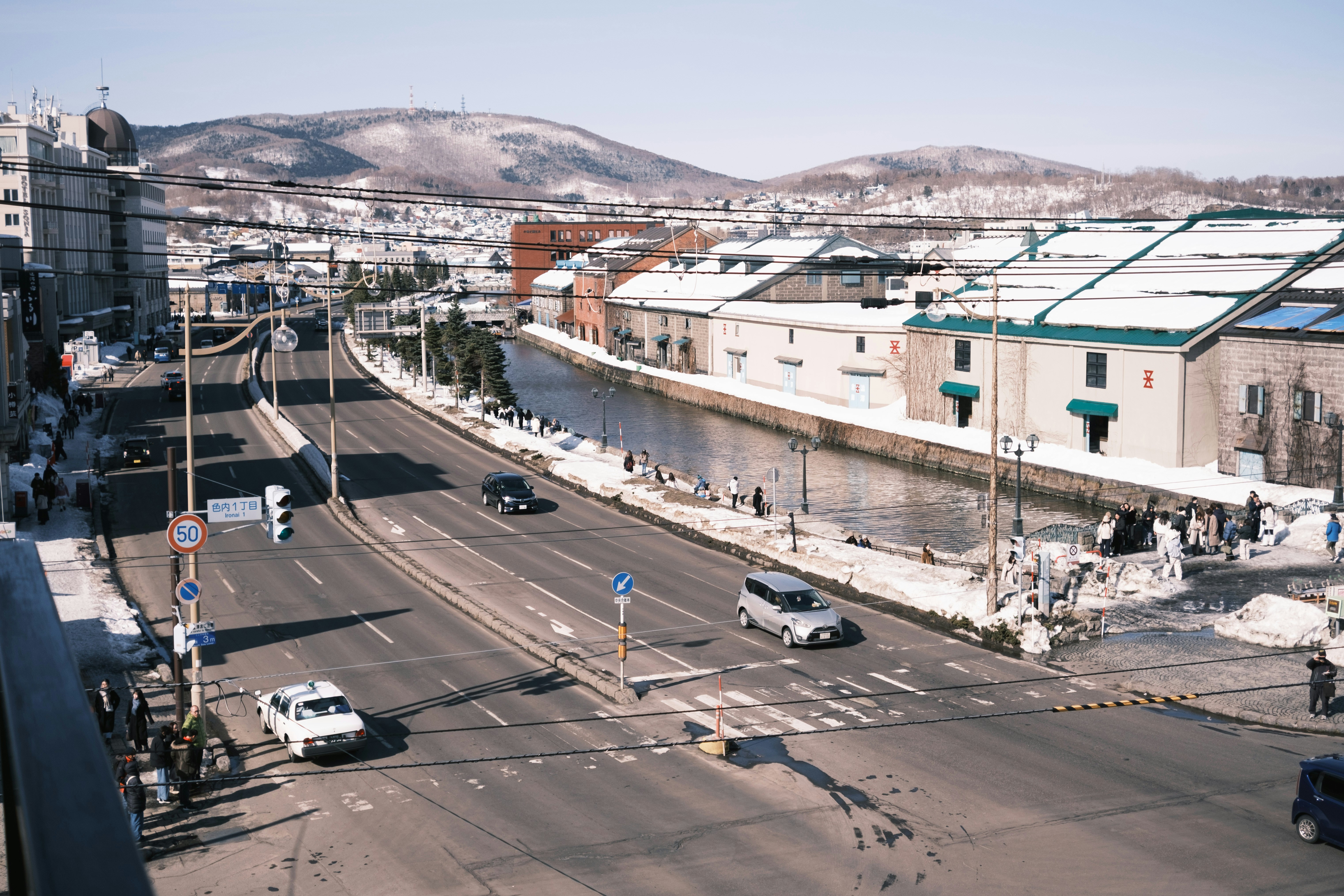 A city street with snow-covered buildings.