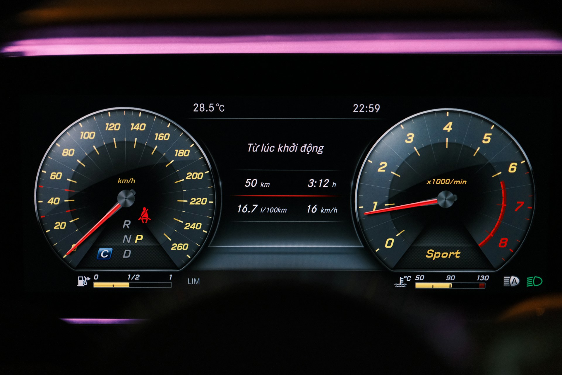Car dashboard displays speed and other information.