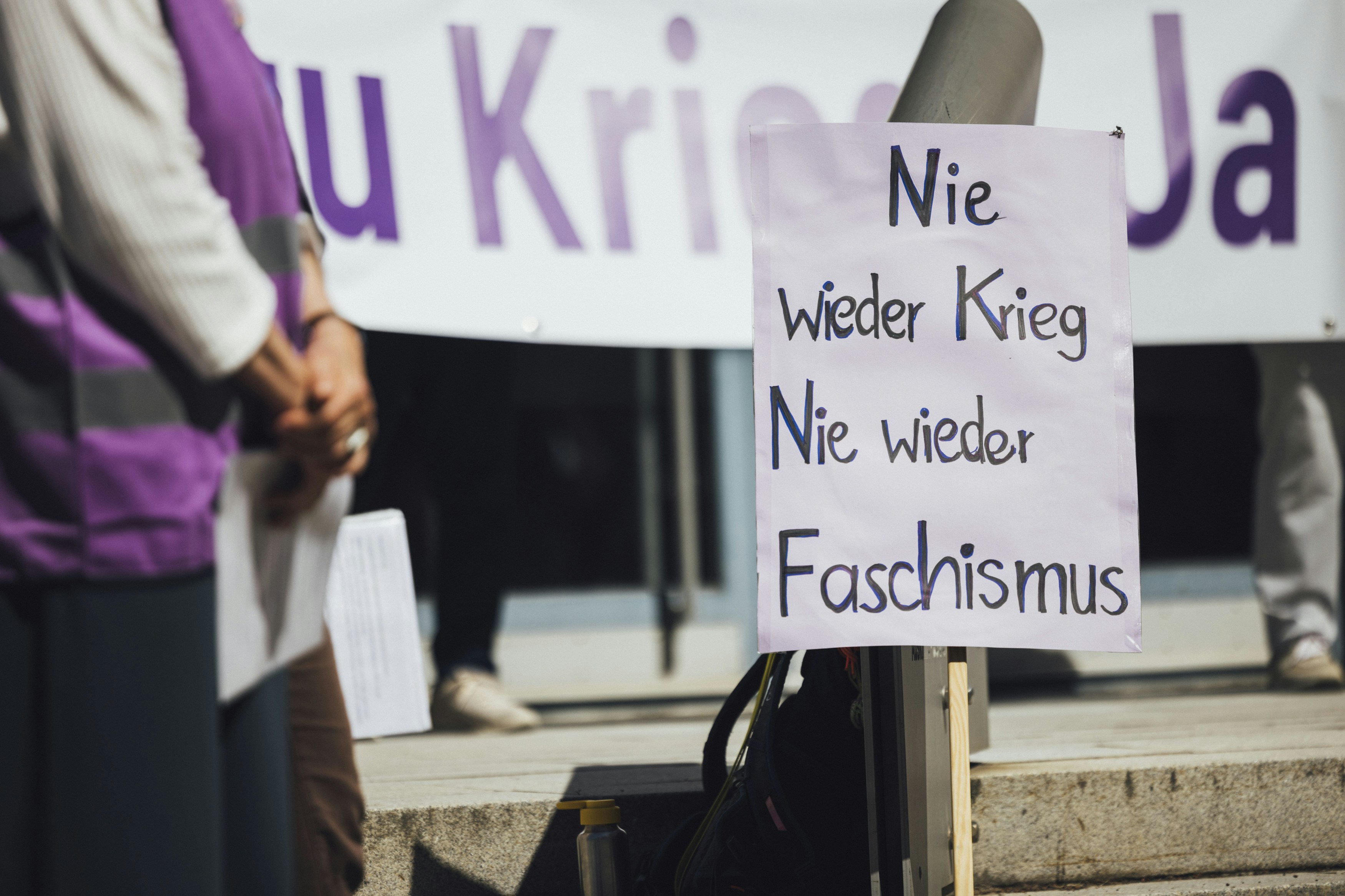 People protest against war and fascism.