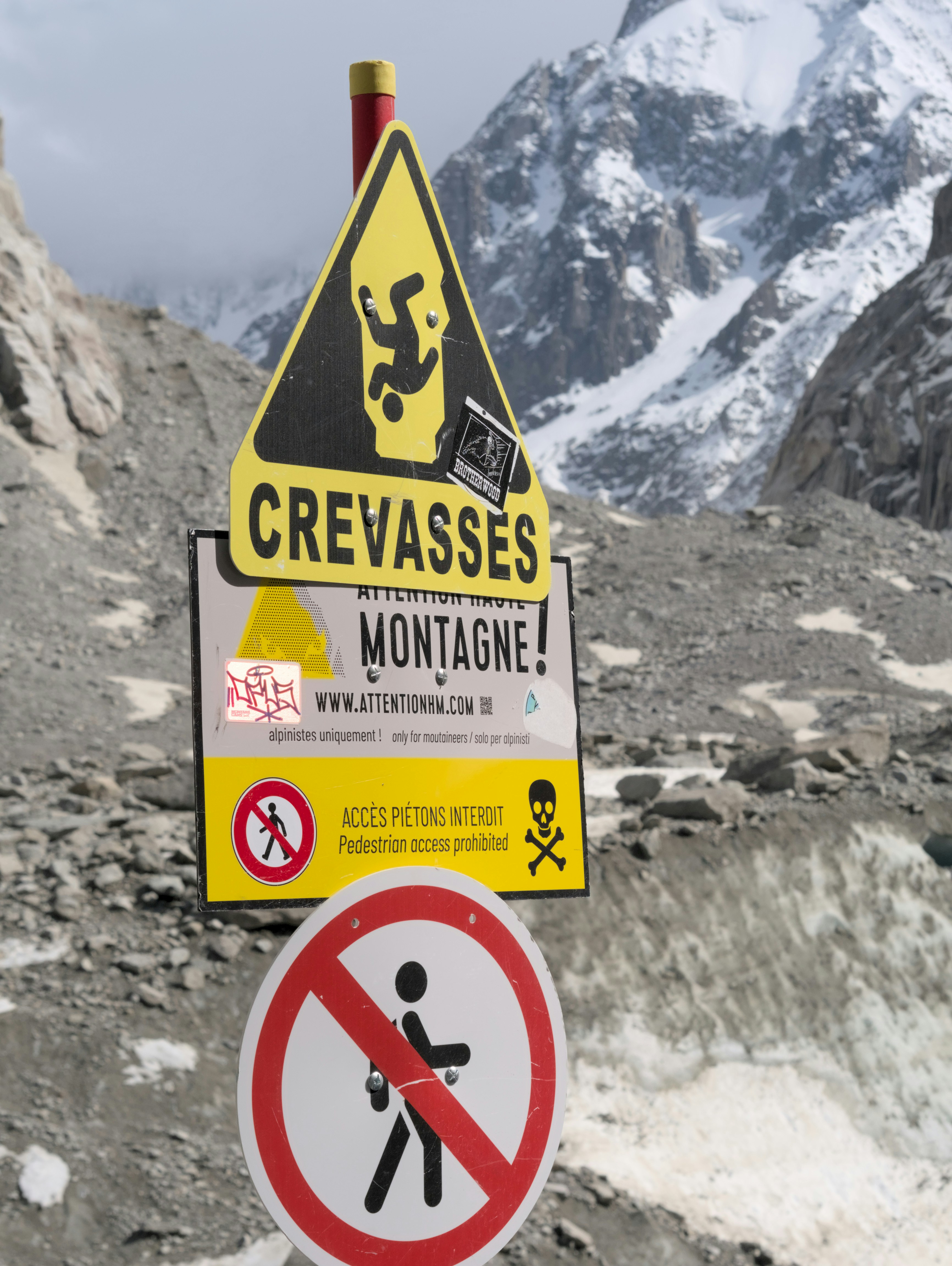 Warning signs indicate dangerous glacier conditions