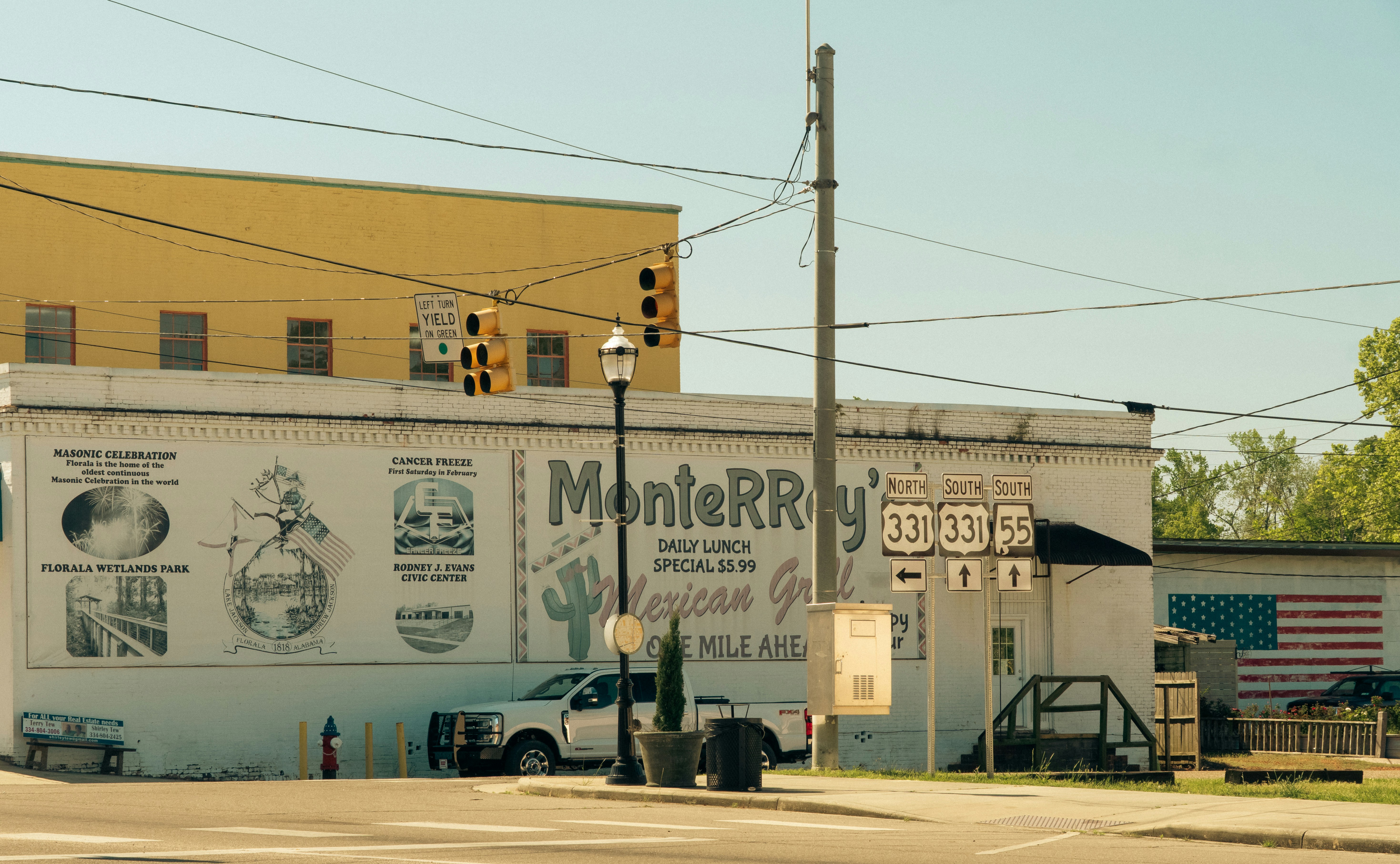 A mexican restaurant with a painted mural is visible.