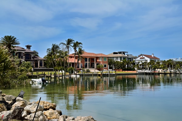 Bay Harbor Islands waterfront homes reflecting in calm water