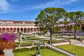 A beautiful courtyard is showcased under a blue sky.