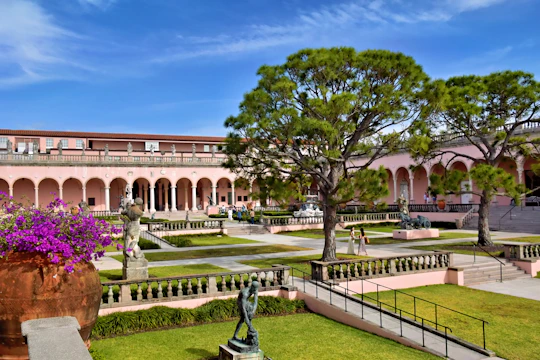 A beautiful courtyard is showcased under a blue sky.