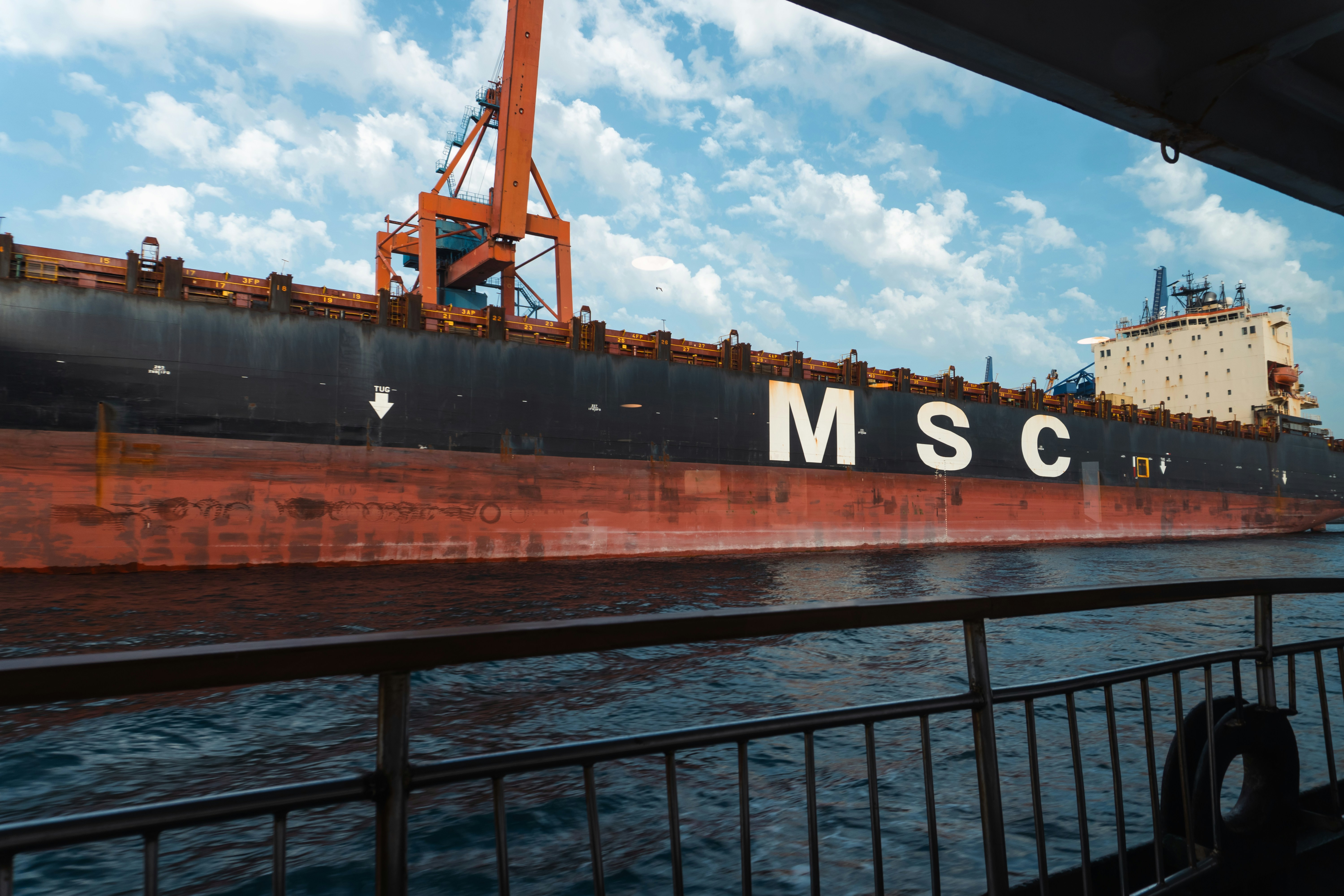 A large msc ship is seen on the water.