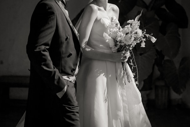 Bride and groom stand together on their wedding day.