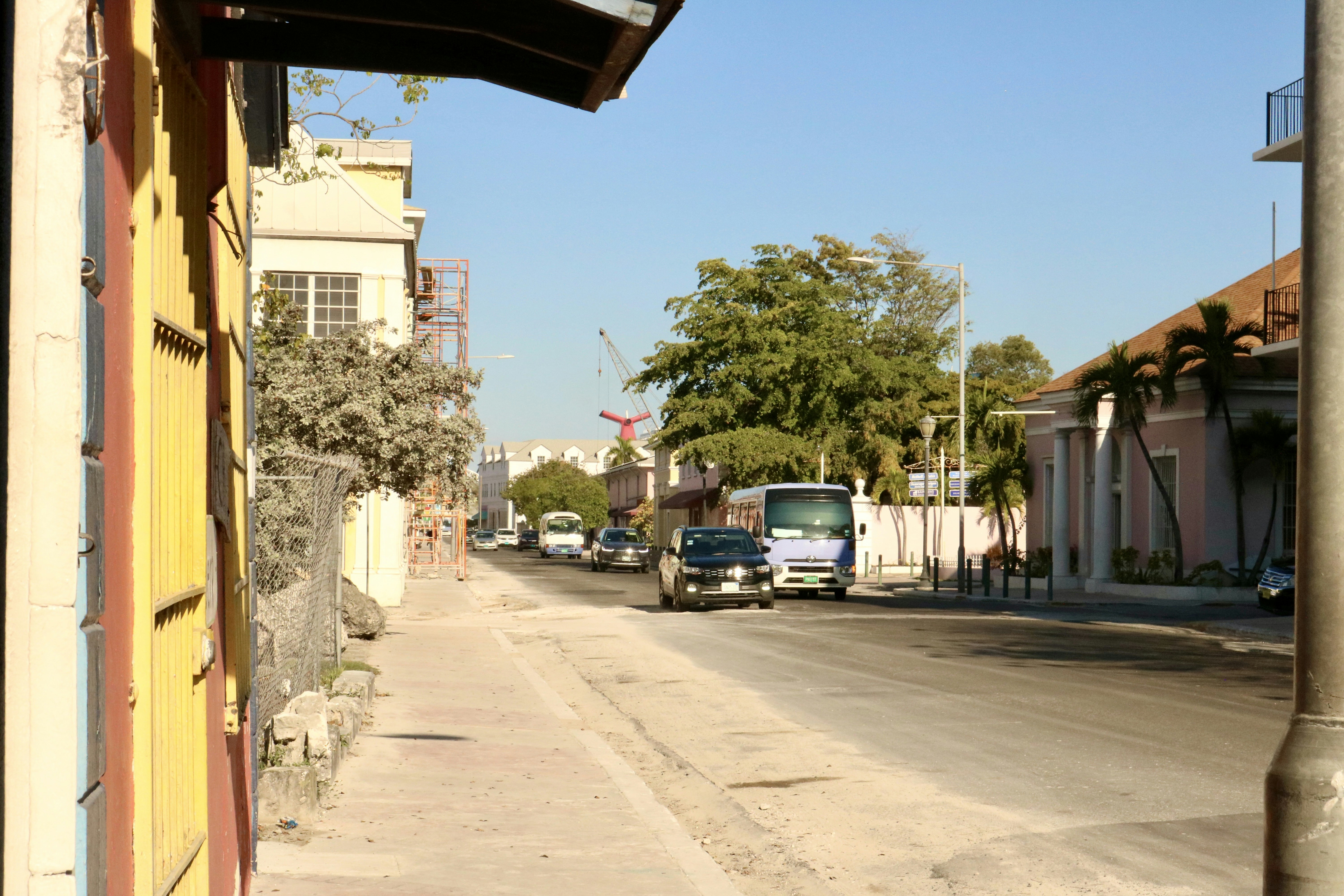 A street scene with buildings and vehicles.