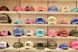 Hats of many colors are displayed on shelves.