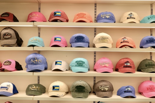 Hats of many colors are displayed on shelves.