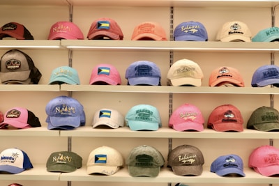 Hats of many colors are displayed on shelves.