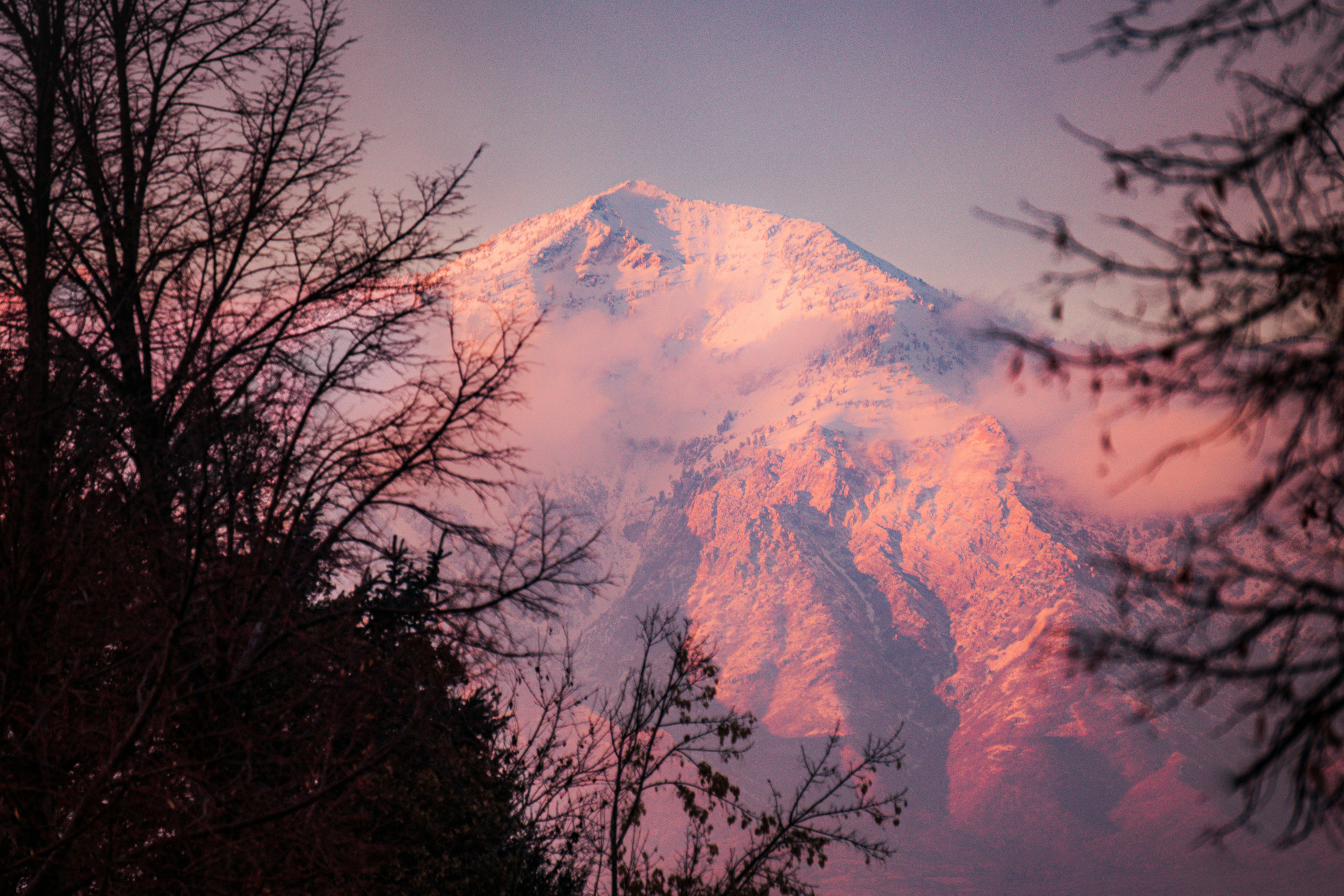 Snowy mountain glows in the soft morning light.