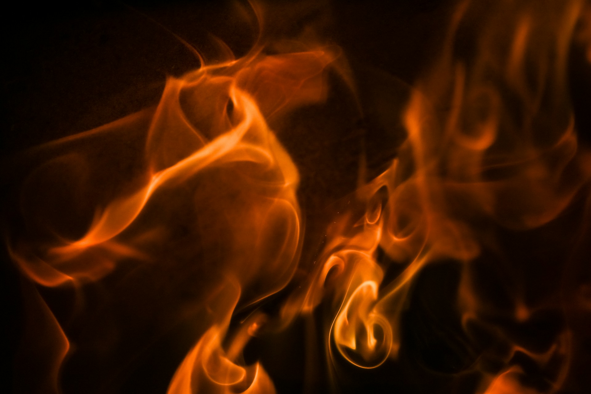 Fiery flames dance in the darkness.