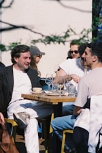 People enjoy lunch outdoors on a sunny day.