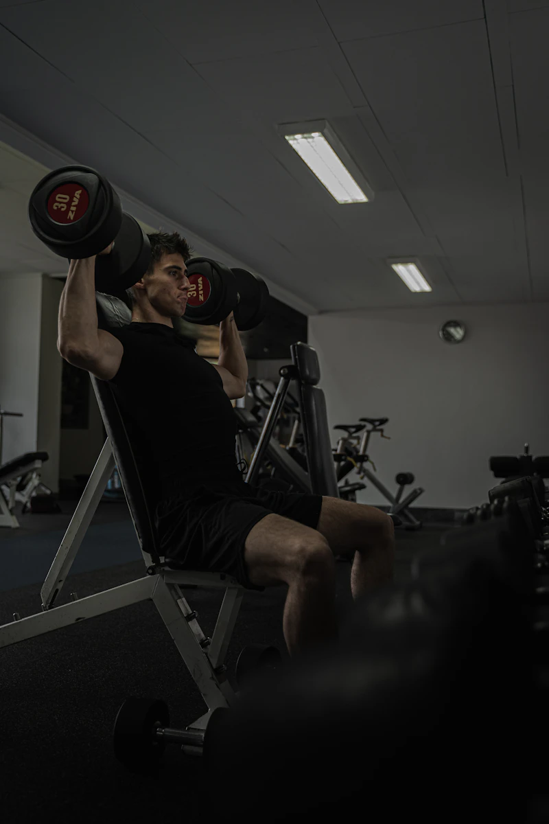 Muscular man in his prime working years lifting weights