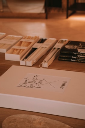 Boxes of objects are displayed on a table.