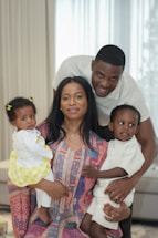 A happy family poses for a portrait together.