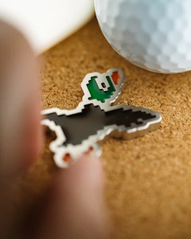 A golf ball duck marker