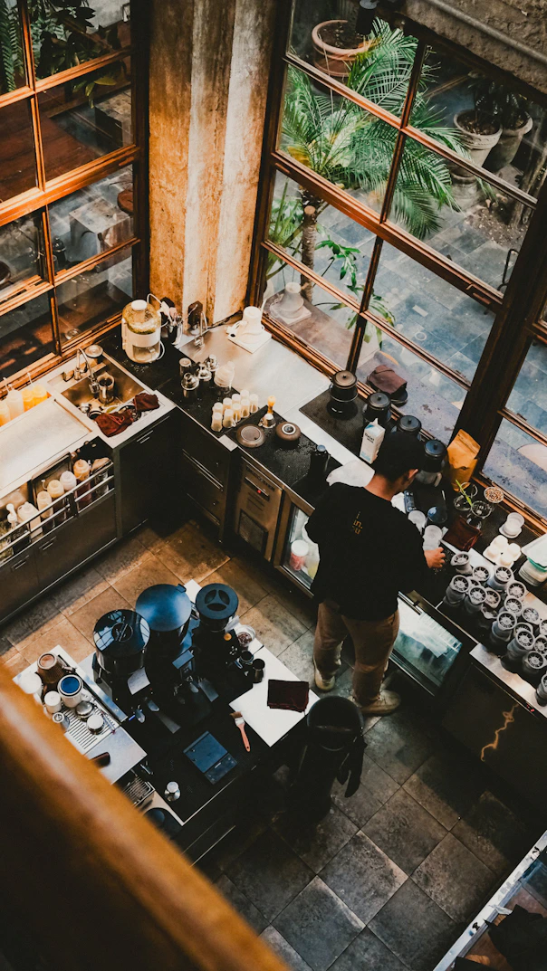 A barista preparing coffee in a modern café.