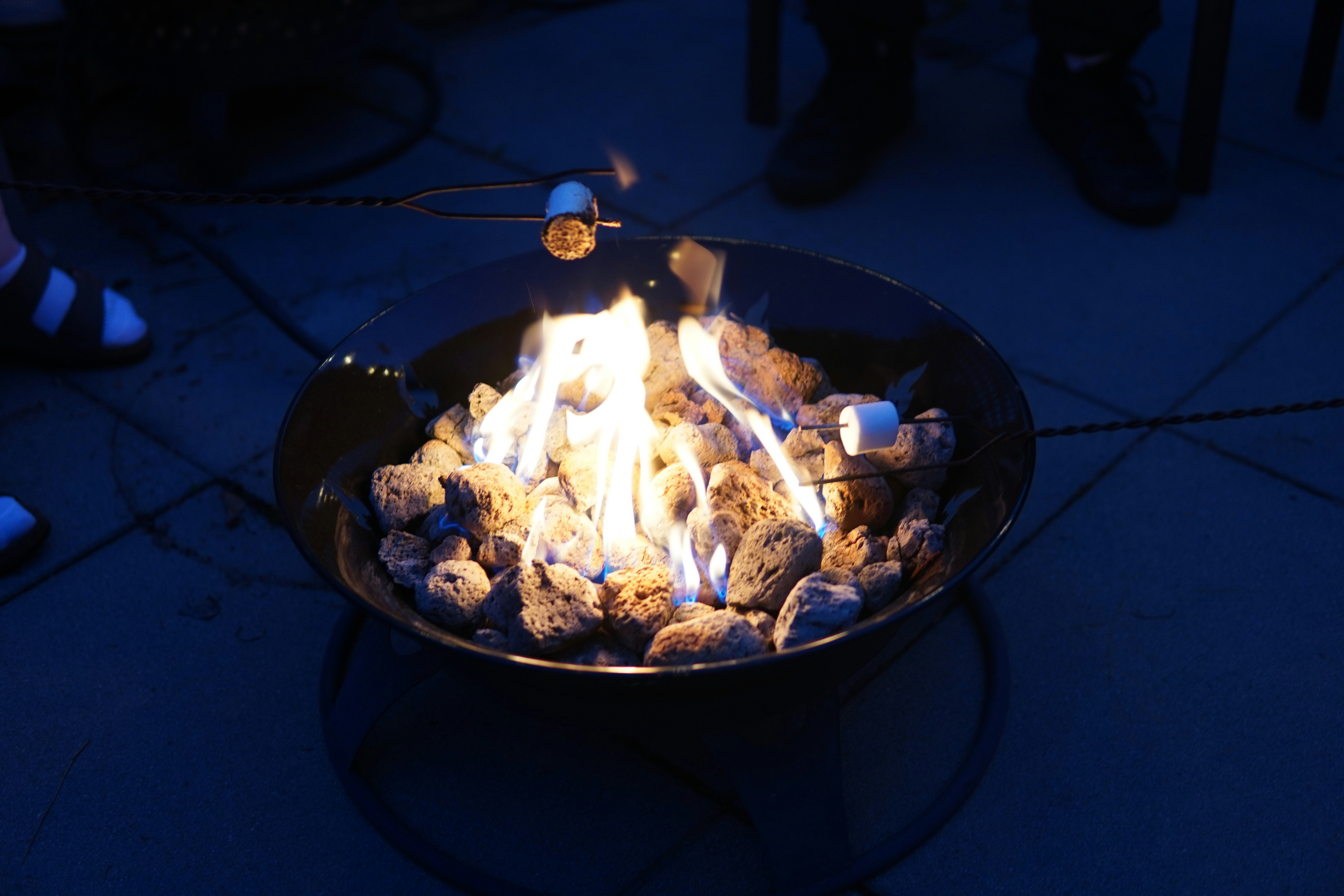 Someone is roasting marshmallows over a fire.