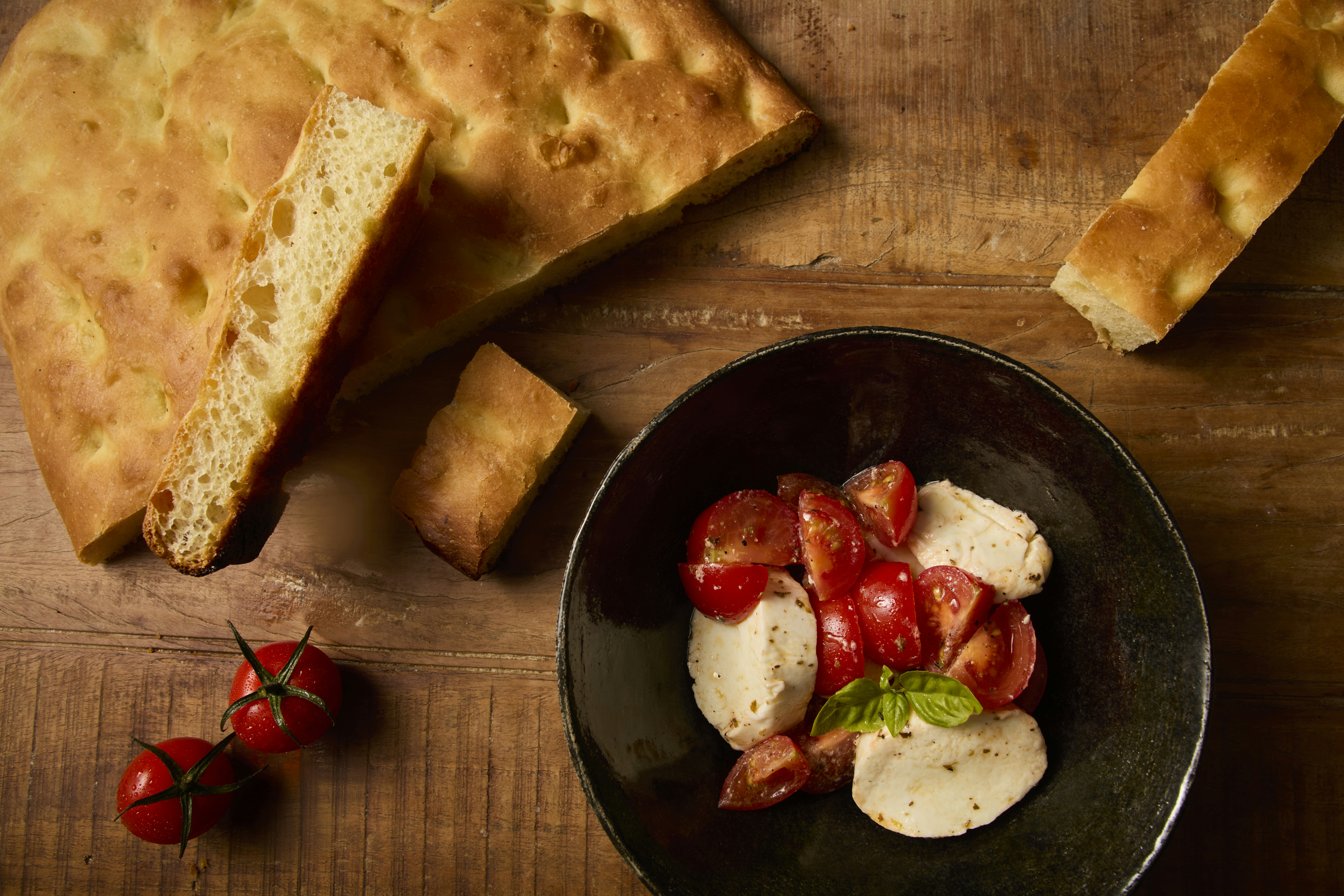 Focaccia bread with tomato and mozzarella salad.