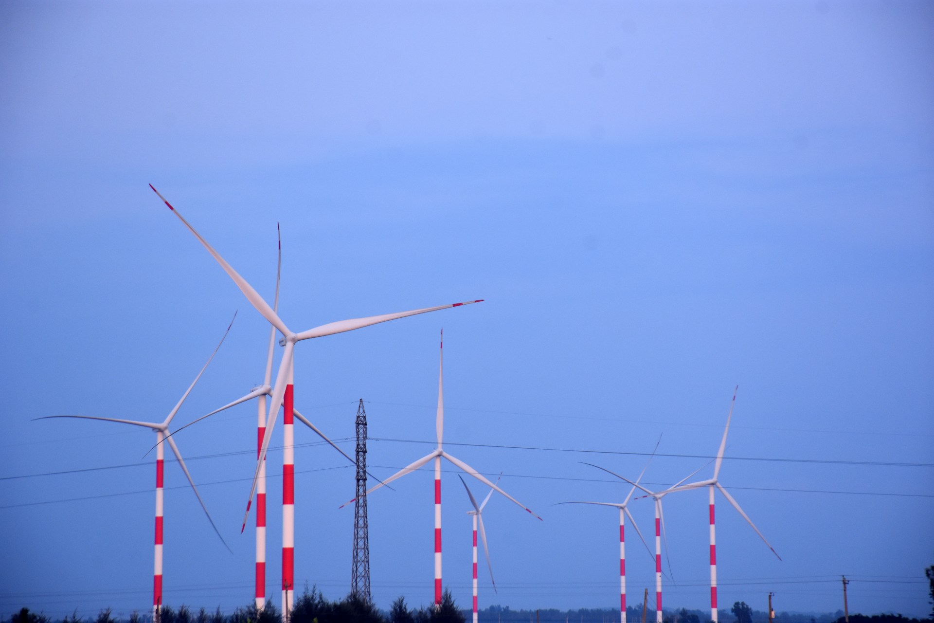 Wind turbines generate clean energy on a clear day.