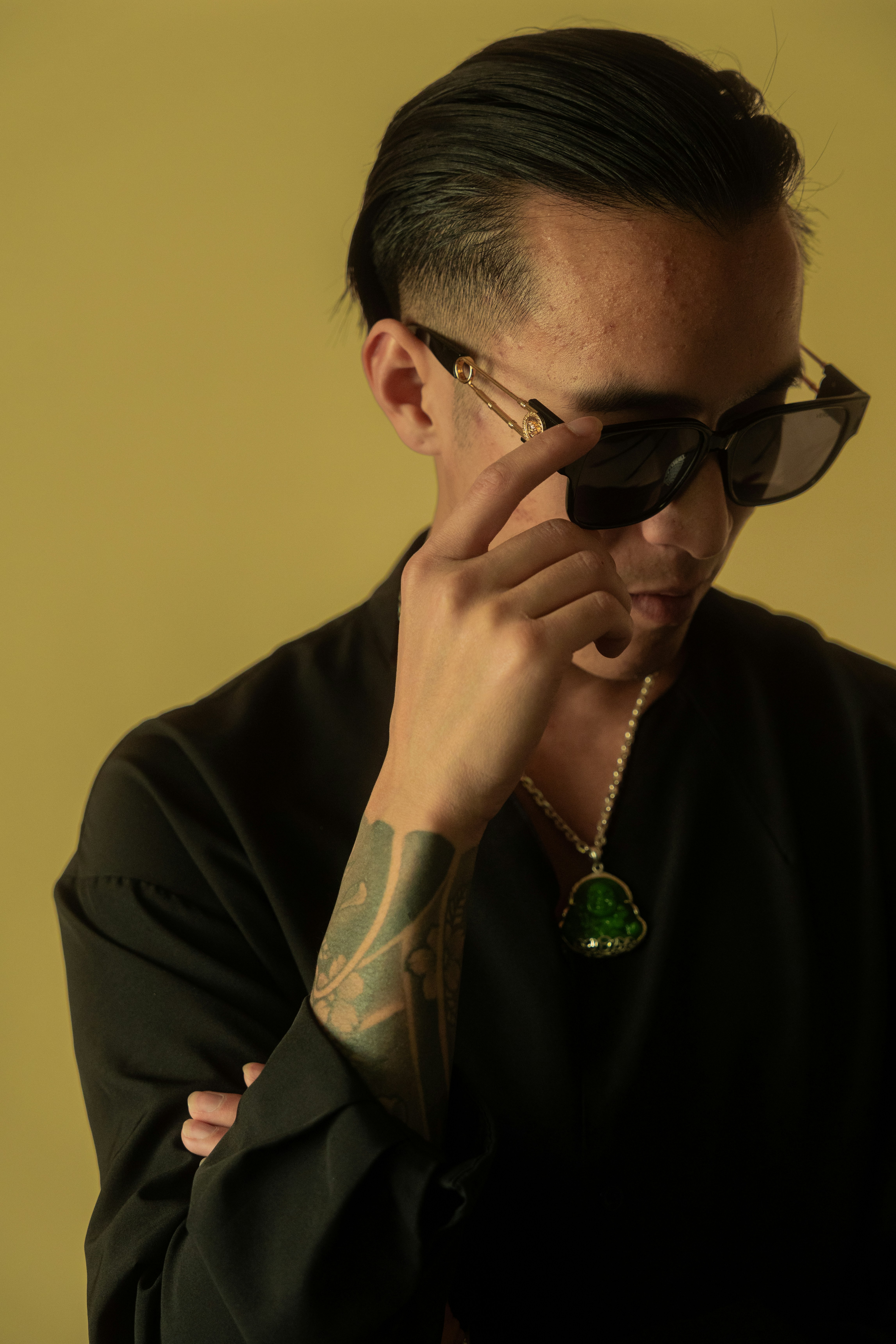 Man in sunglasses looking stylish and cool.