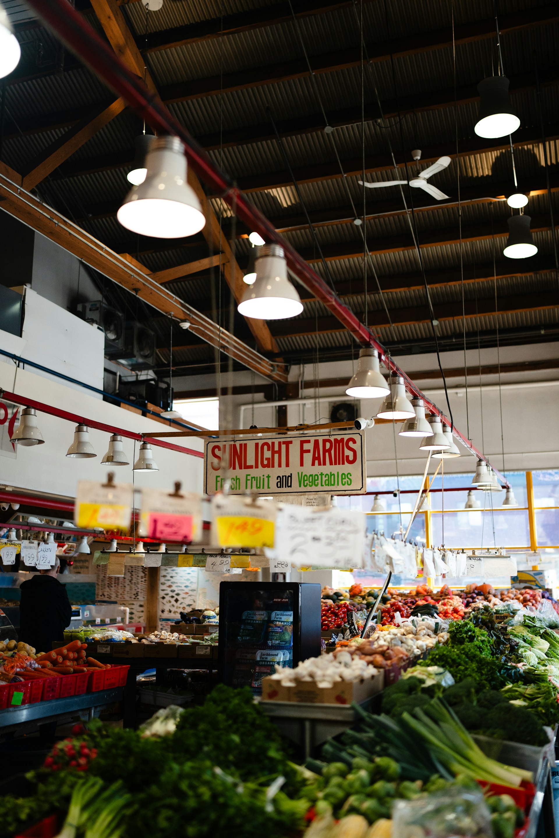 A produce stand sells fresh fruits and vegetables.