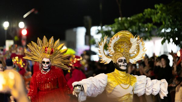 People wear skeletal face paint at a celebration — Mérida, Mexico