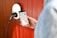 Person uses phone to control electric vehicle charger.