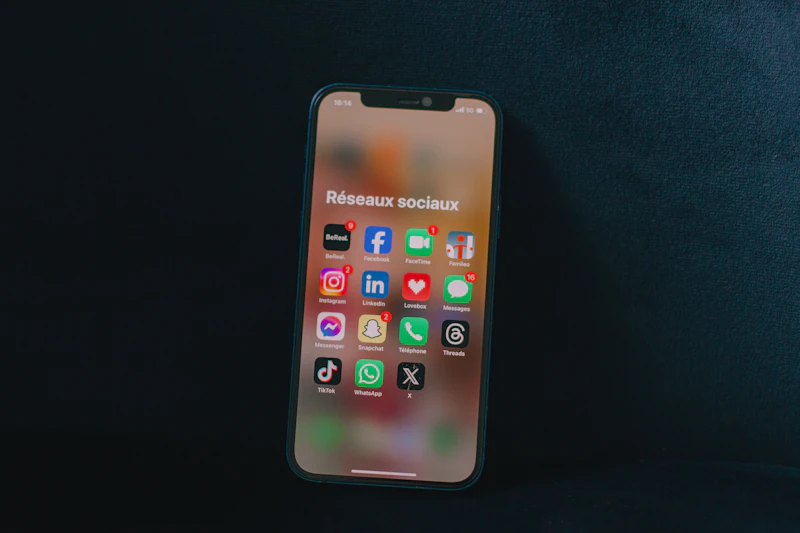Smartphone displaying social media app icons, representing digital marketing